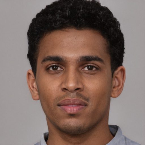 Neutral black young-adult male with short  brown hair and brown eyes