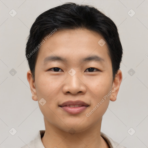 Joyful asian young-adult male with short  black hair and brown eyes