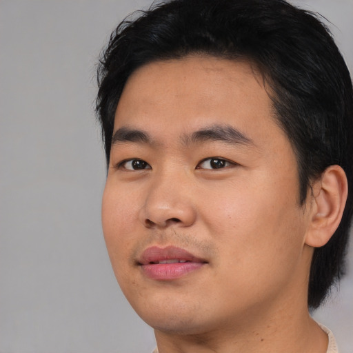 Neutral asian young-adult male with short  black hair and brown eyes