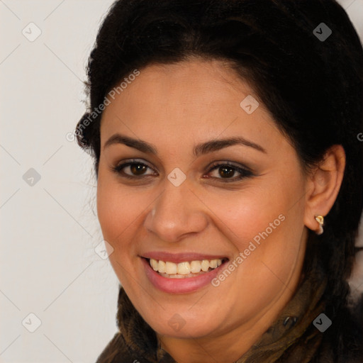 Joyful latino young-adult female with long  brown hair and brown eyes