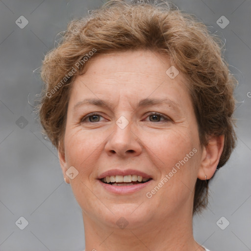 Joyful white adult female with short  brown hair and brown eyes