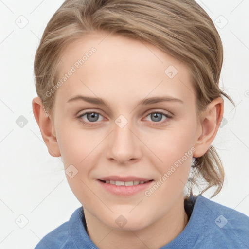 Joyful white young-adult female with medium  brown hair and blue eyes