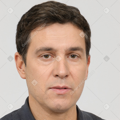 Neutral white adult male with short  brown hair and brown eyes