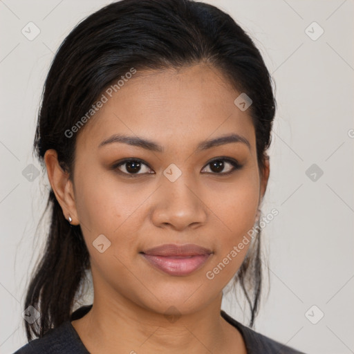 Joyful latino young-adult female with medium  brown hair and brown eyes