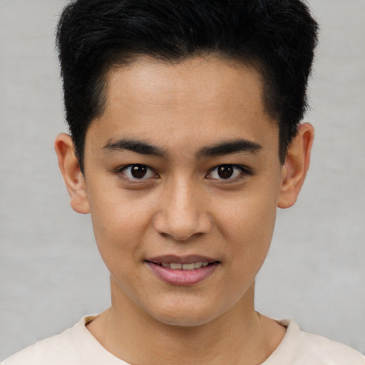 Joyful asian young-adult male with short  black hair and brown eyes