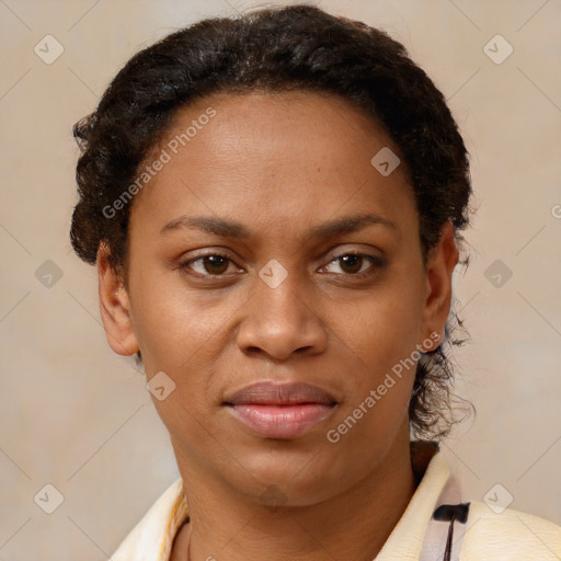 Joyful black adult female with short  brown hair and brown eyes