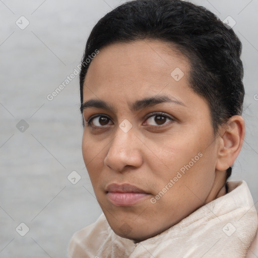 Joyful latino young-adult female with short  brown hair and brown eyes