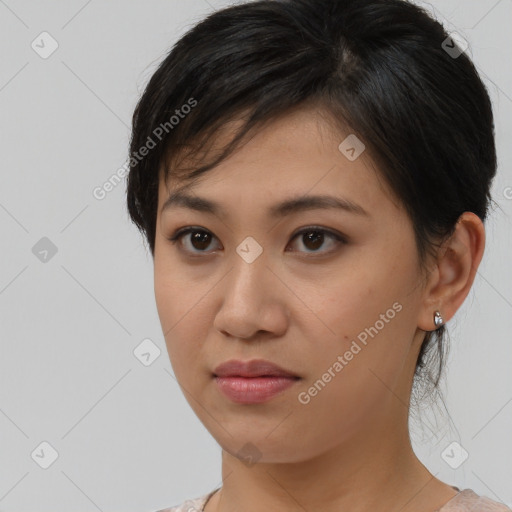 Joyful asian young-adult female with medium  brown hair and brown eyes