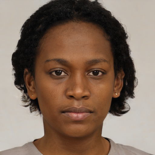 Neutral black young-adult female with short  brown hair and brown eyes