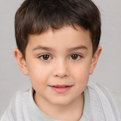 Joyful white child male with short  brown hair and brown eyes