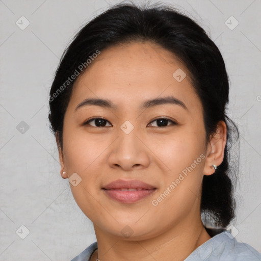 Joyful asian young-adult female with medium  black hair and brown eyes