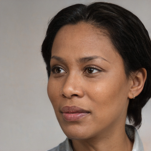 Neutral black young-adult female with medium  black hair and brown eyes