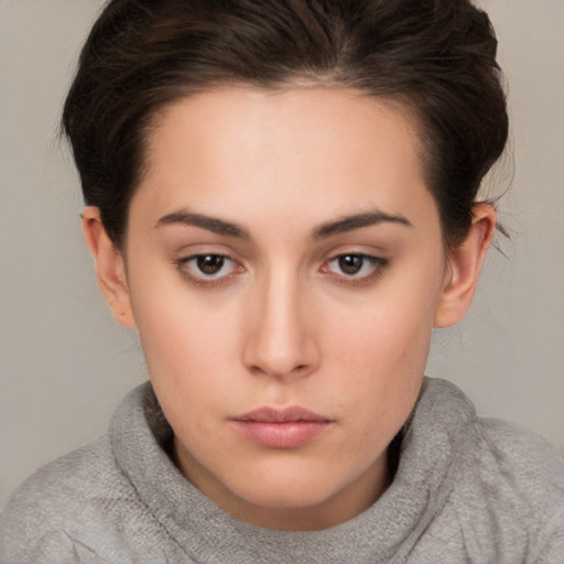 Neutral white young-adult female with short  brown hair and brown eyes