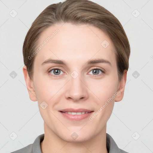 Joyful white young-adult female with short  brown hair and grey eyes