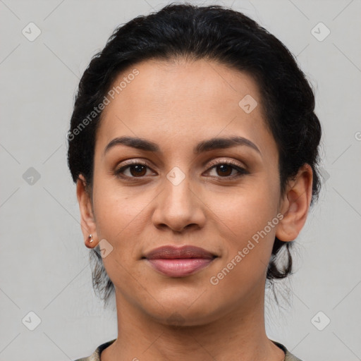 Joyful latino young-adult female with short  black hair and brown eyes