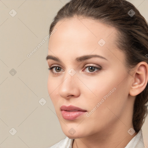 Neutral white young-adult female with medium  brown hair and brown eyes