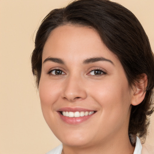 Joyful white young-adult female with medium  brown hair and brown eyes