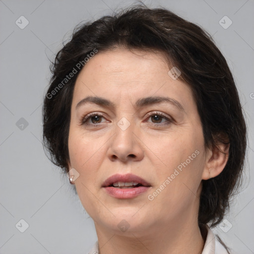 Joyful white adult female with medium  brown hair and brown eyes