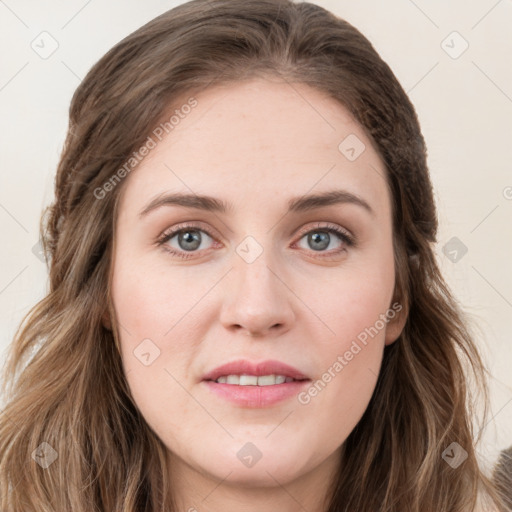 Joyful white young-adult female with long  brown hair and blue eyes