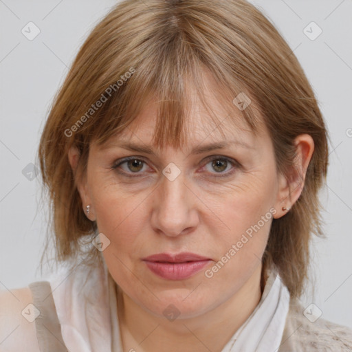 Joyful white adult female with medium  brown hair and grey eyes