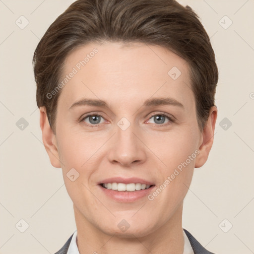 Joyful white young-adult female with short  brown hair and grey eyes