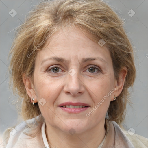 Joyful white adult female with medium  brown hair and grey eyes