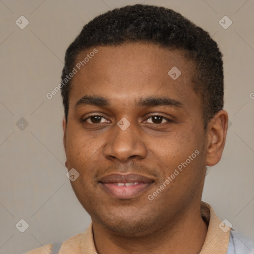 Joyful black young-adult male with short  brown hair and brown eyes