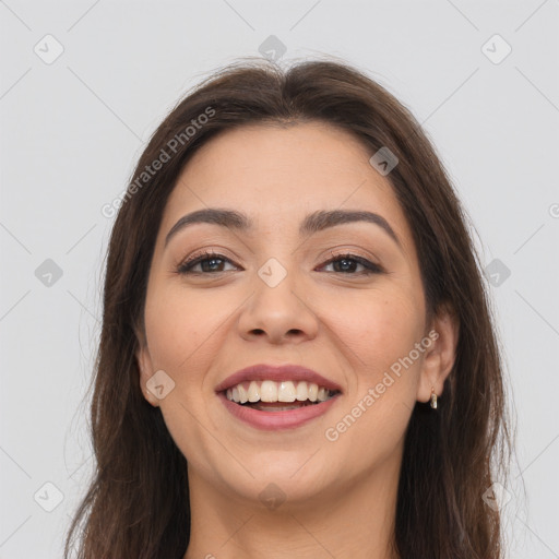 Joyful white young-adult female with long  brown hair and brown eyes