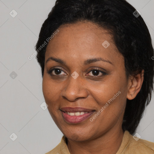 Joyful latino adult female with medium  brown hair and brown eyes