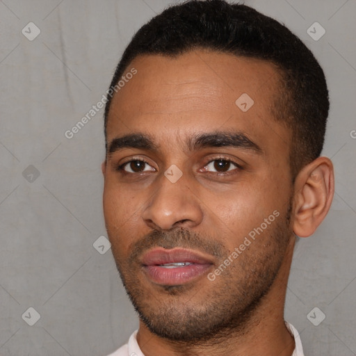 Joyful latino young-adult male with short  black hair and brown eyes