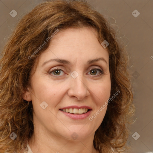 Joyful white adult female with medium  brown hair and green eyes