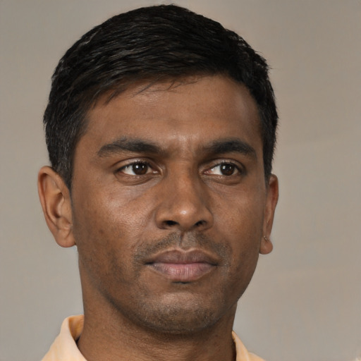 Neutral black young-adult male with short  black hair and brown eyes
