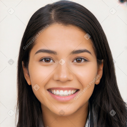 Joyful latino young-adult female with long  brown hair and brown eyes