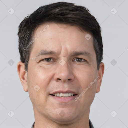 Joyful white adult male with short  brown hair and brown eyes