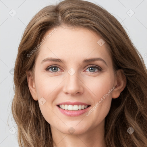 Joyful white young-adult female with long  brown hair and green eyes