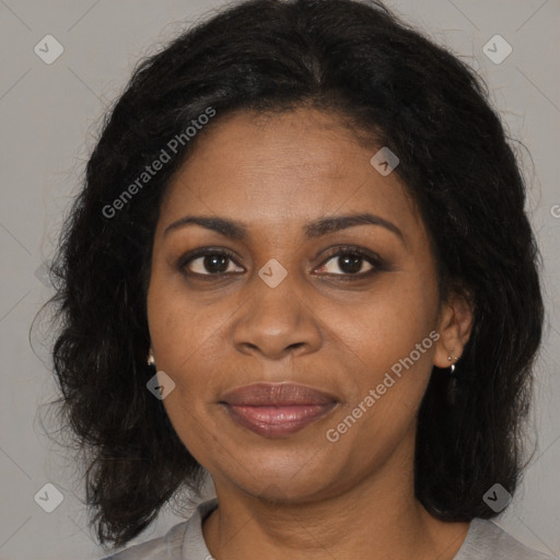 Joyful black adult female with medium  brown hair and brown eyes