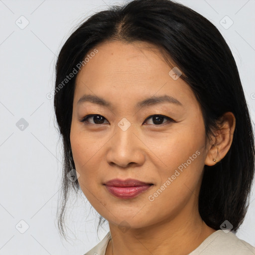 Joyful asian young-adult female with medium  black hair and brown eyes