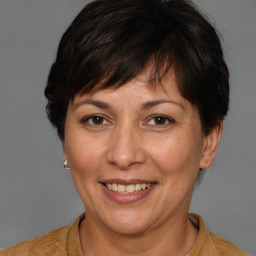 Joyful white adult female with short  brown hair and brown eyes