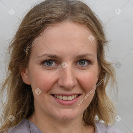 Joyful white young-adult female with medium  brown hair and blue eyes