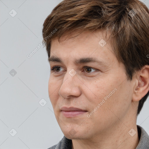 Joyful white adult male with short  brown hair and brown eyes