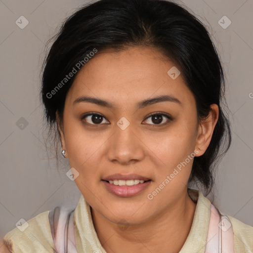 Joyful latino young-adult female with medium  brown hair and brown eyes