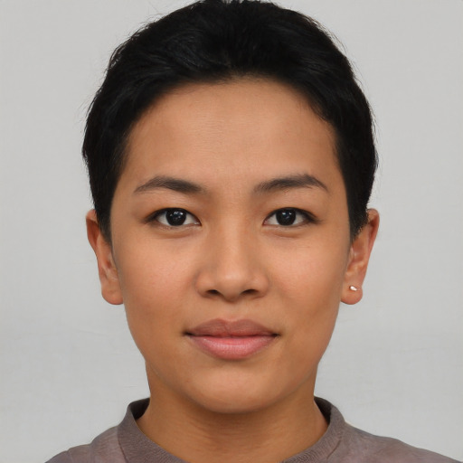 Joyful asian young-adult female with short  black hair and brown eyes