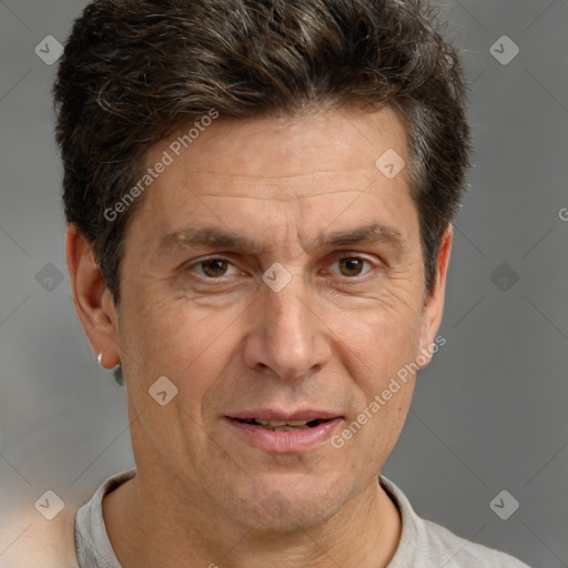 Joyful white adult male with short  brown hair and brown eyes