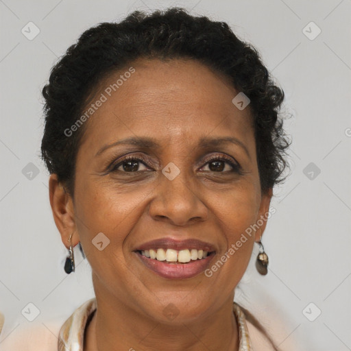 Joyful black adult female with short  brown hair and brown eyes