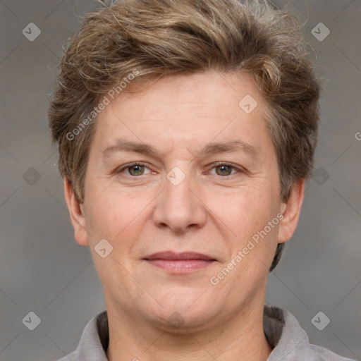 Joyful white adult female with short  brown hair and grey eyes