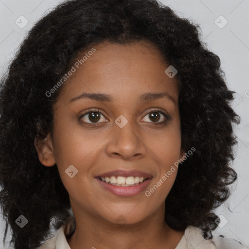 Joyful black young-adult female with long  brown hair and brown eyes