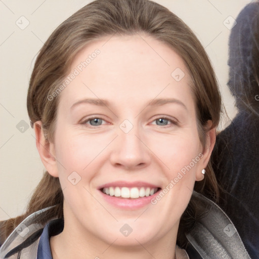 Joyful white young-adult female with medium  brown hair and grey eyes