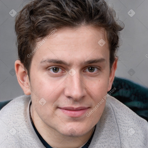 Joyful white young-adult male with short  brown hair and blue eyes