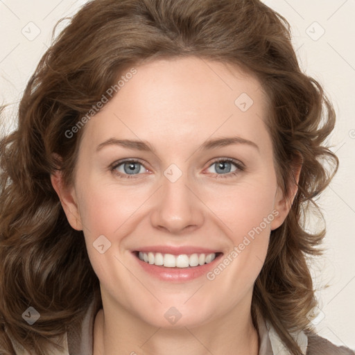 Joyful white young-adult female with long  brown hair and blue eyes