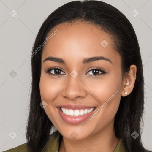 Joyful latino young-adult female with long  brown hair and brown eyes